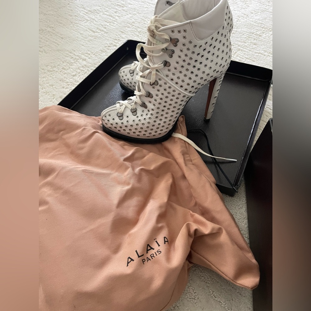 ALAIA GROMMET HEELED BOOTS (sz 37.5)